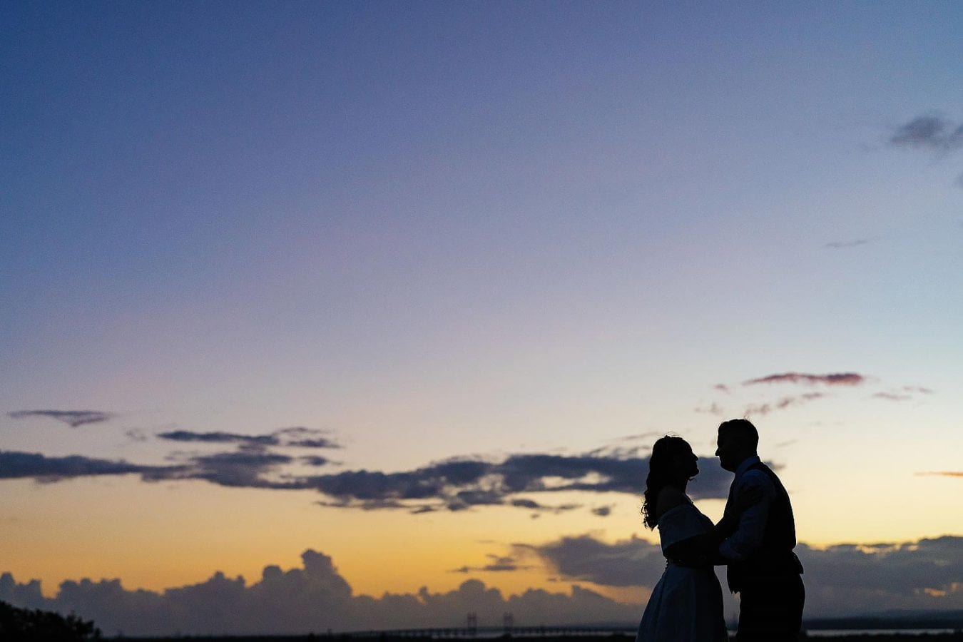 bride and groom at sunset