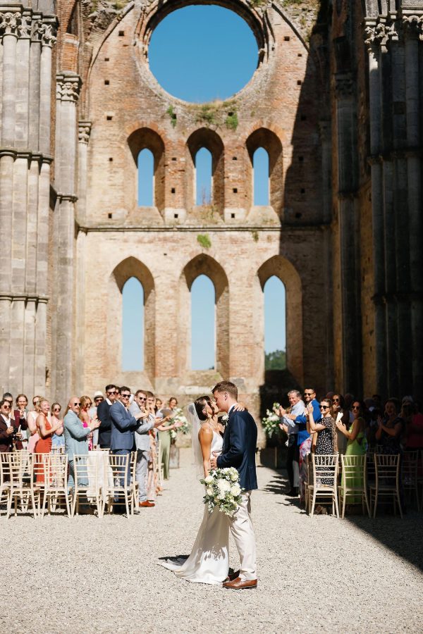 bride and groom first kiss san galgano