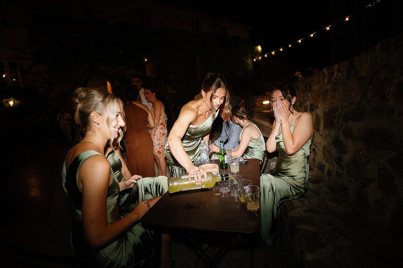 bridesmaids pouring drinks