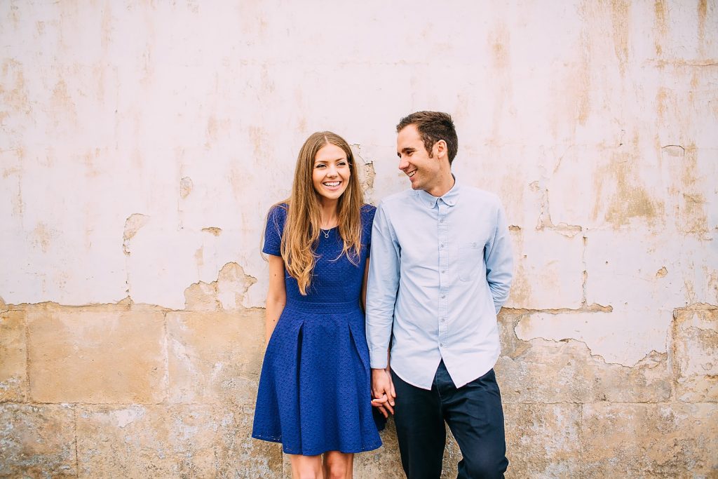 couple standing together laughing