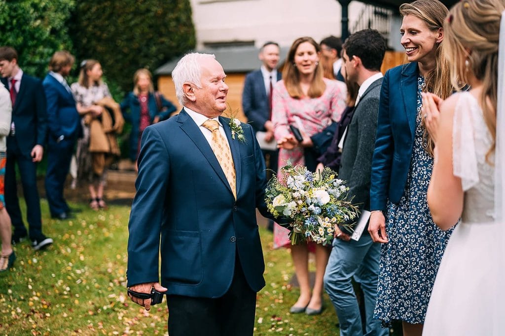 fob holding wedding flowers