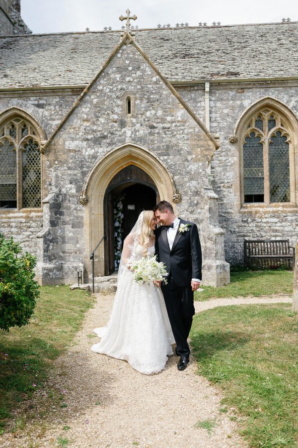 couple exit Lulworth Castle church
