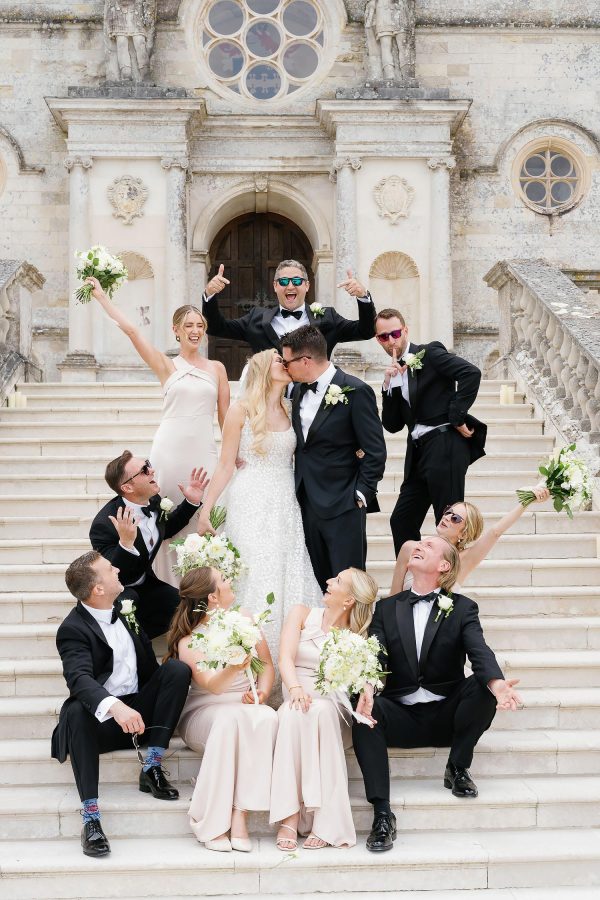 bridal party on Lulworth Castle steps