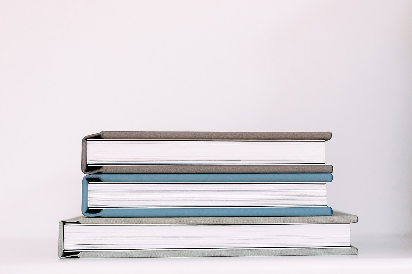 stack of wedding albums