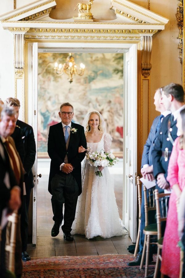 bride walking down the aisle in St Giles House