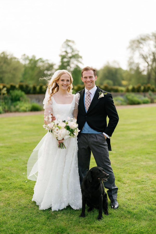 bride, groom and dog St Giles House wedding photo