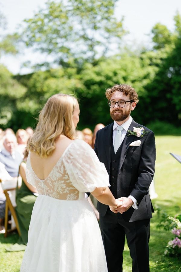 groom looking at bride