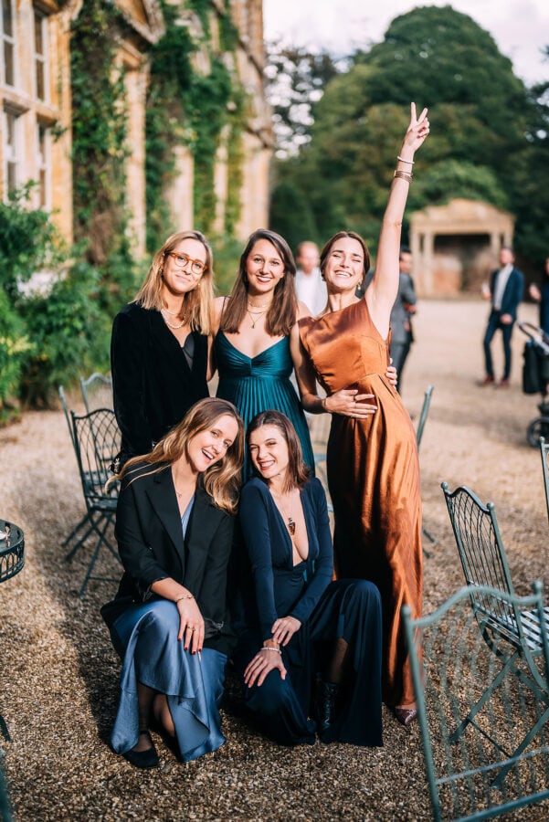 wedding guests pose for a photo