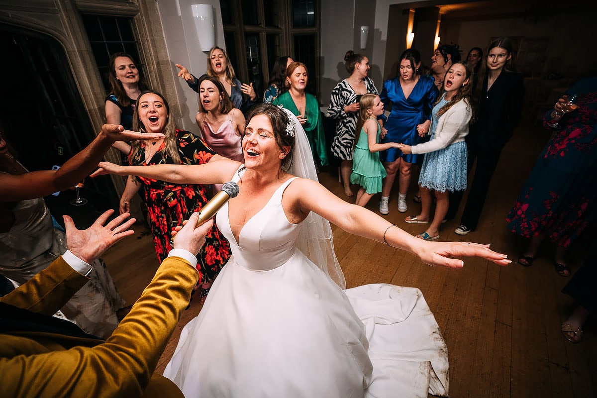 bride dancing inside Coombe Lodge wedding