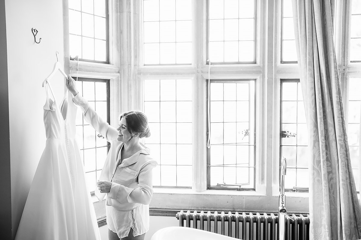 bride putting up her wedding dress