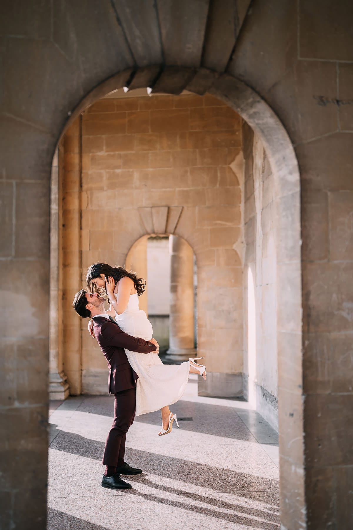 groom picking up bride