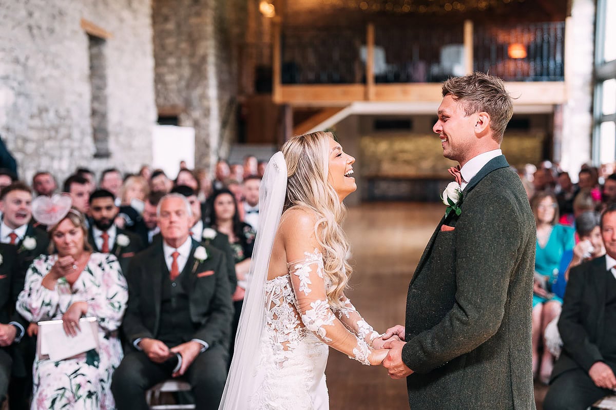couple laughing at their wedding ceremony 
