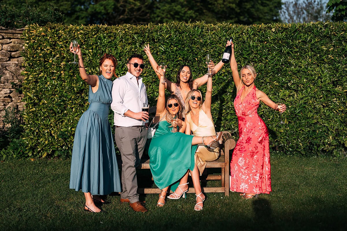 guests posing for wedding photo
