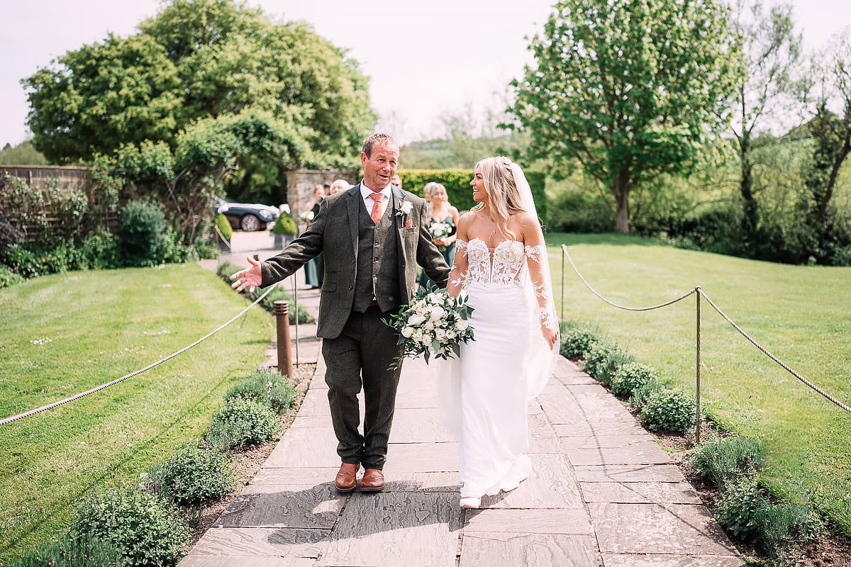 bride and father walking to Priston Mill ceremony
