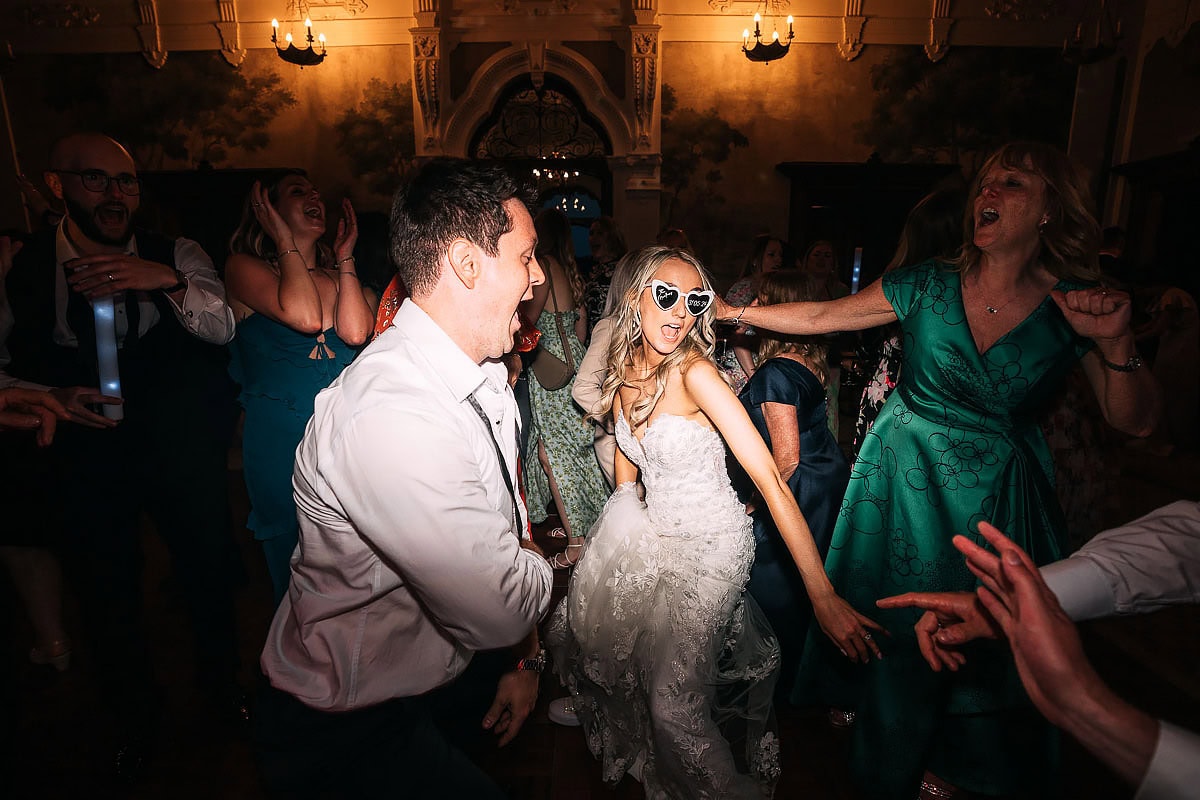 bride and groom dancing together at wedding