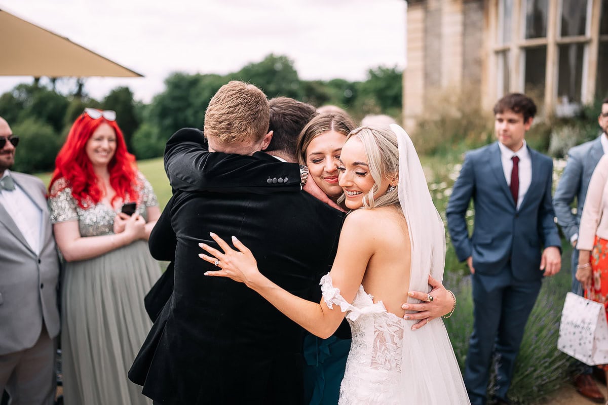 friends hugging outside Clevedon Hall