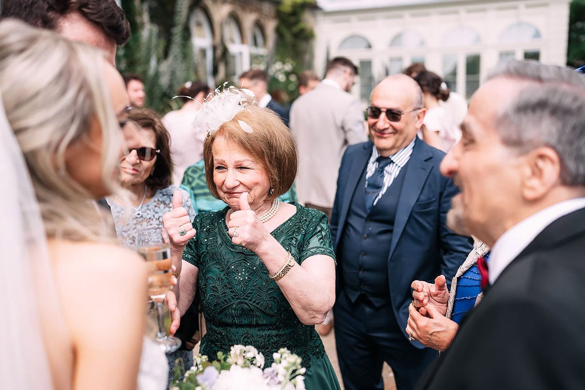 thumbs up to bride