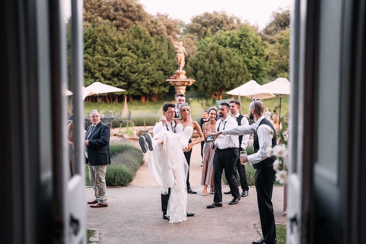 groom lifting up bride
