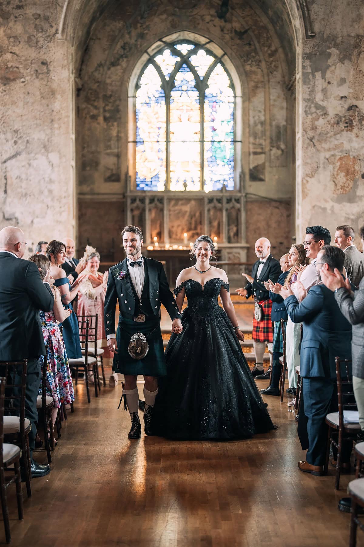 bride and groom walking down aisle together