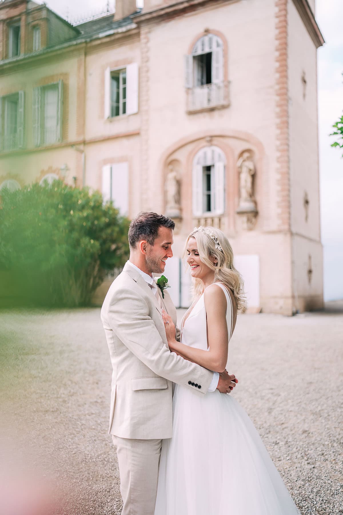 couple portraits outside Chateau De Seyre wedding venue
