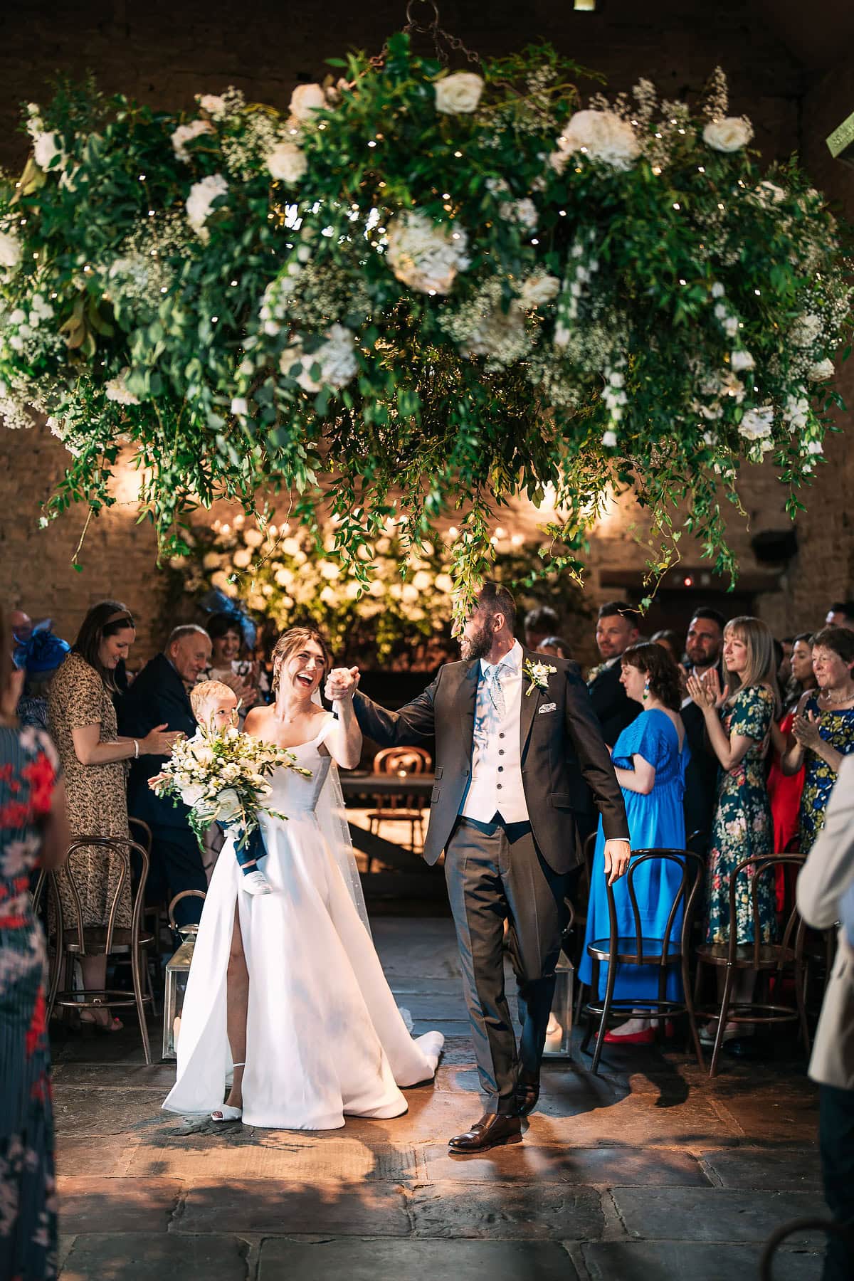 bride and groom walking out of wedding ceremony