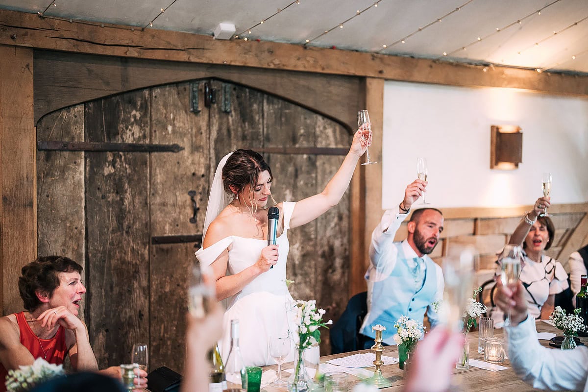 bride raises a toast