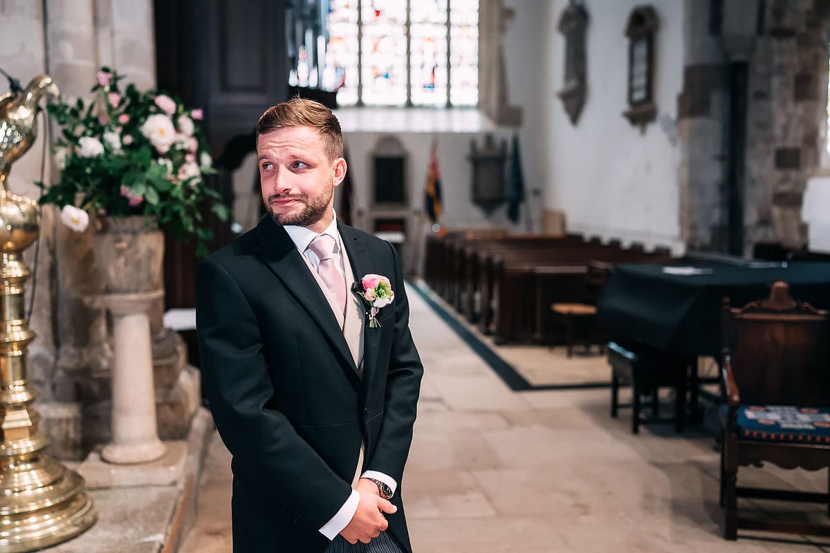 emotional groom sees bride for the first time