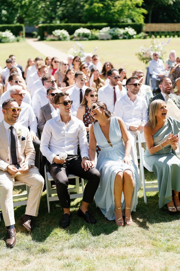 wedding guests laughing