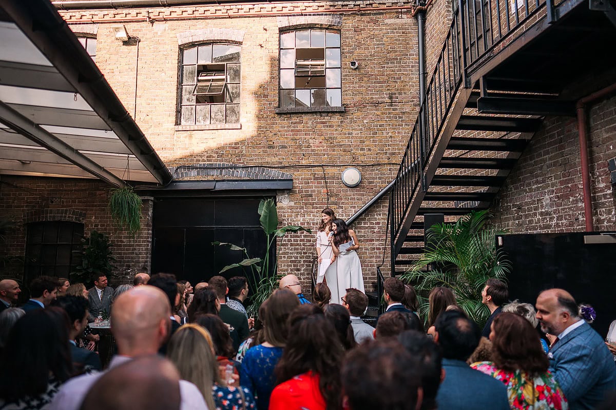 brides giving wedding speech at loft studios