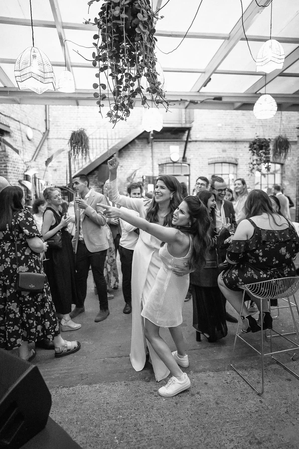 bride and sister dancing 