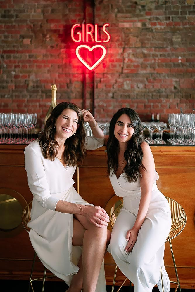 two brides at the bar