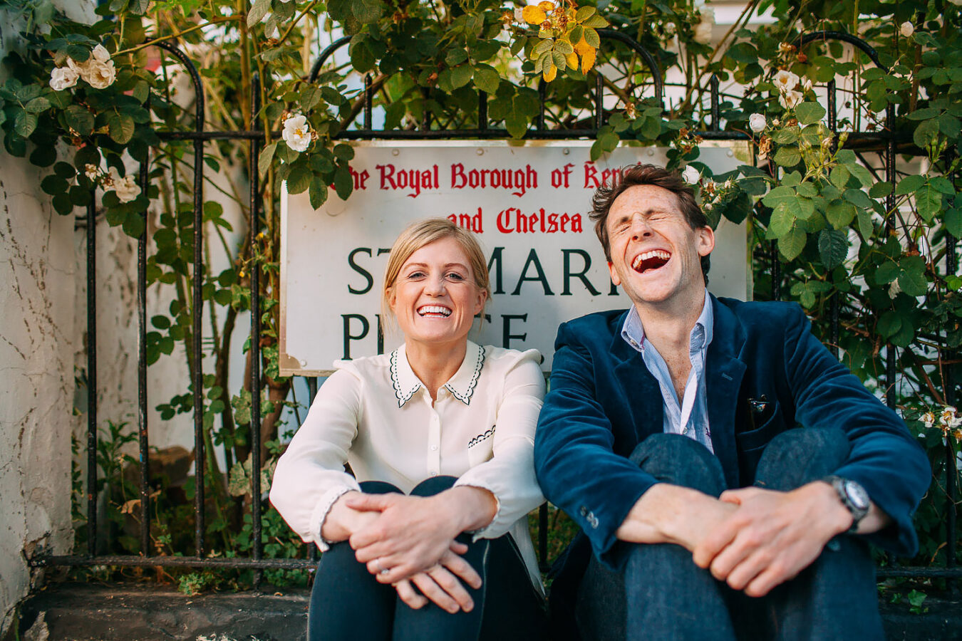couple laughing on kensington engagement shoot