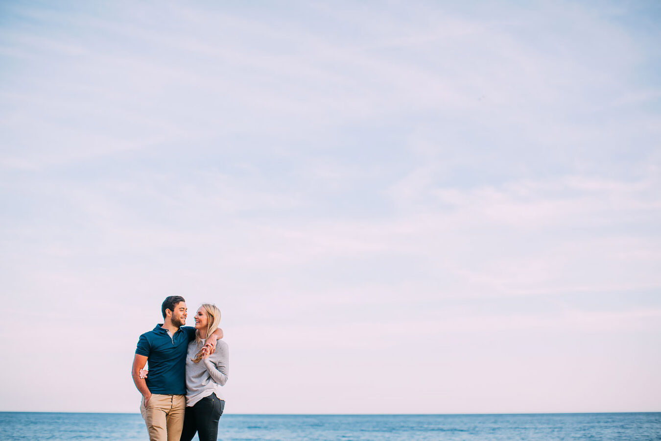 couple standing together by the sea