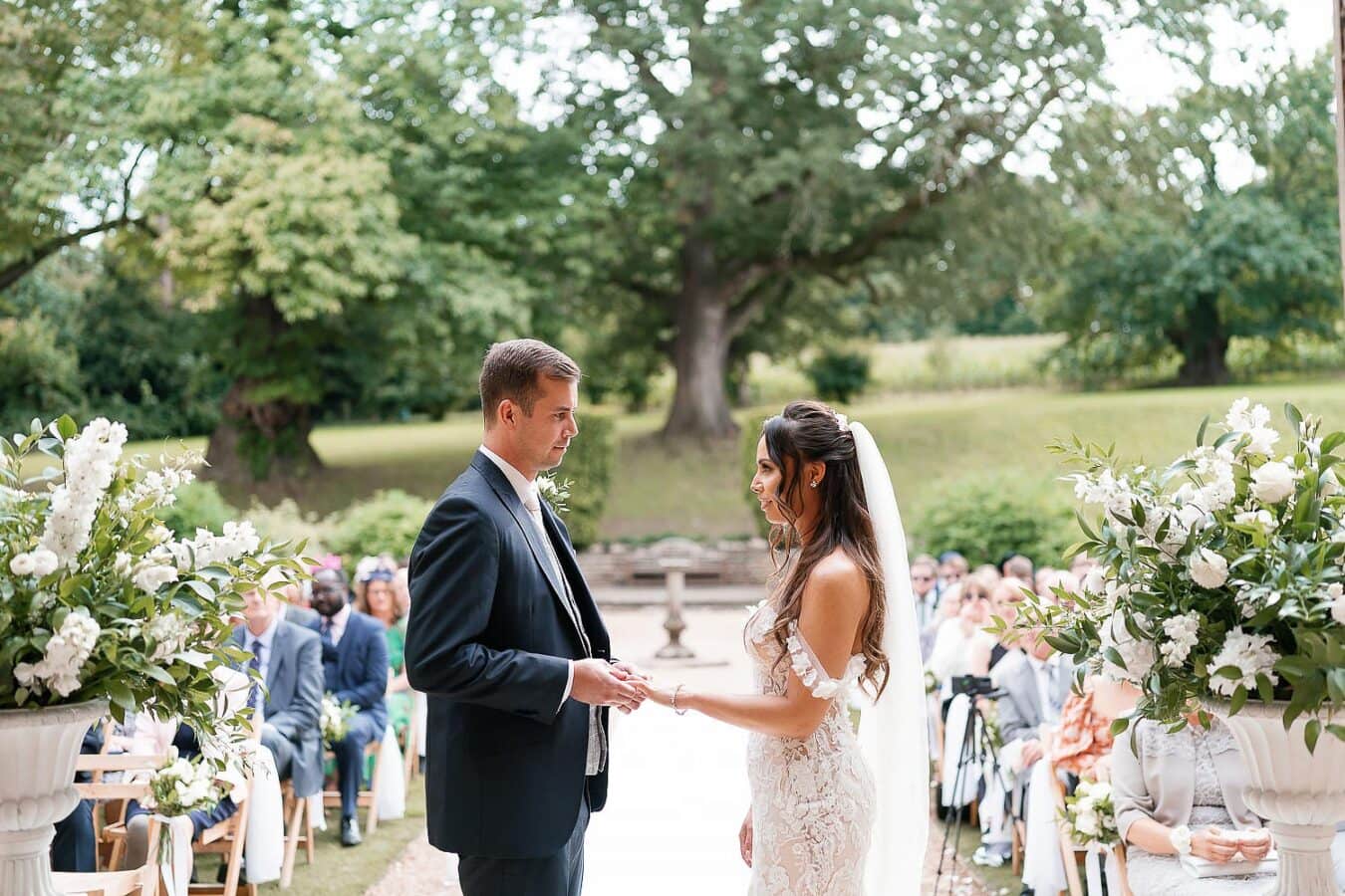 bride and groom exchanging vows outdoor
