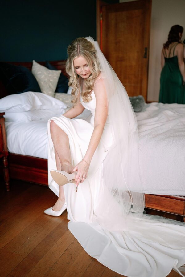 bride putting on her shoe