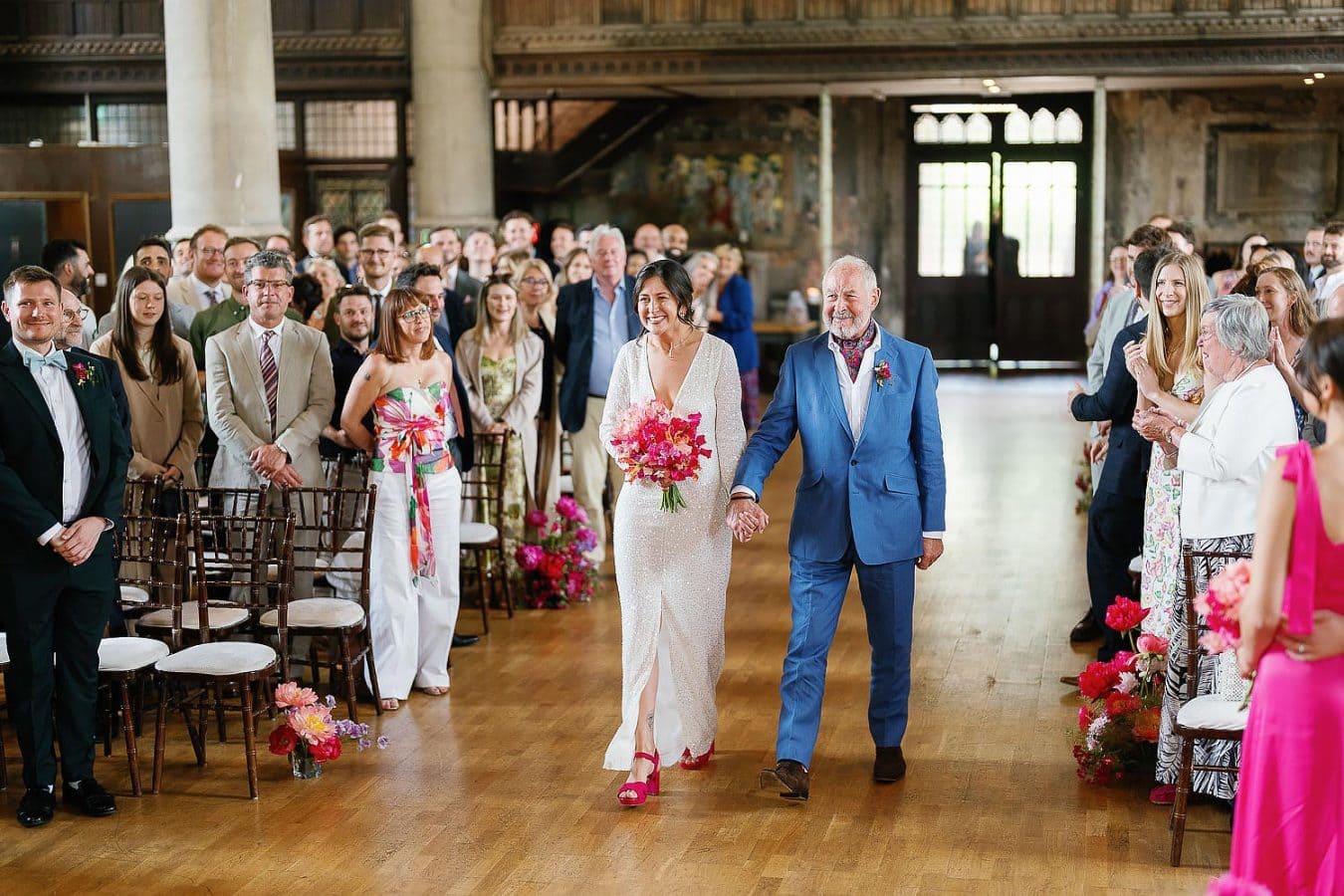 bride walking down the aisle with dad