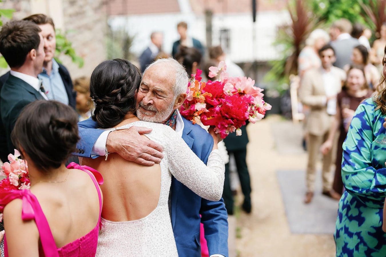 bride and her dad hug