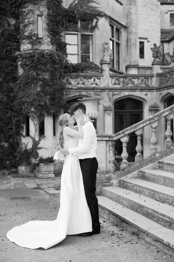 couple photo outside Castle Combe Manor House