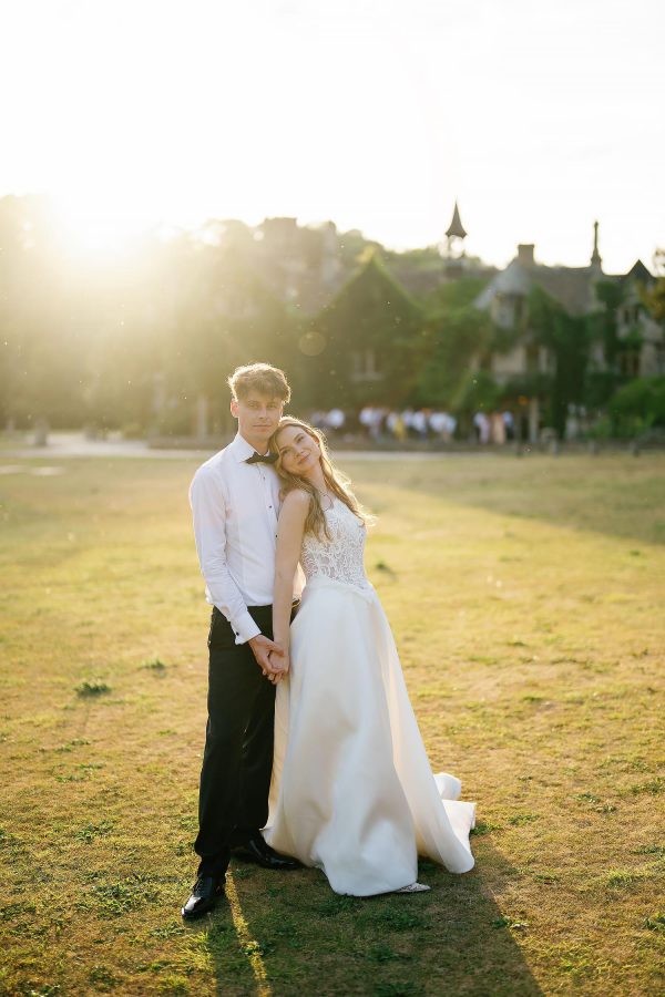 editorial wedding photo of couple outside Castle Combe Manor House