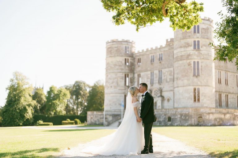 couple photos outside lulworth castle