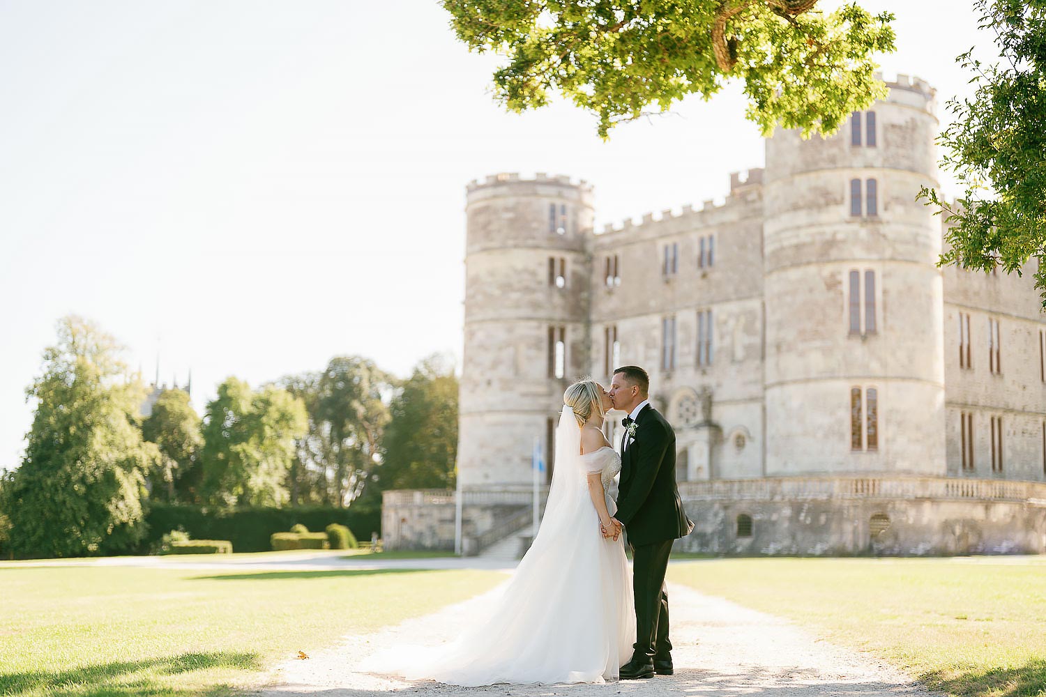 couple photos outside lulworth castle