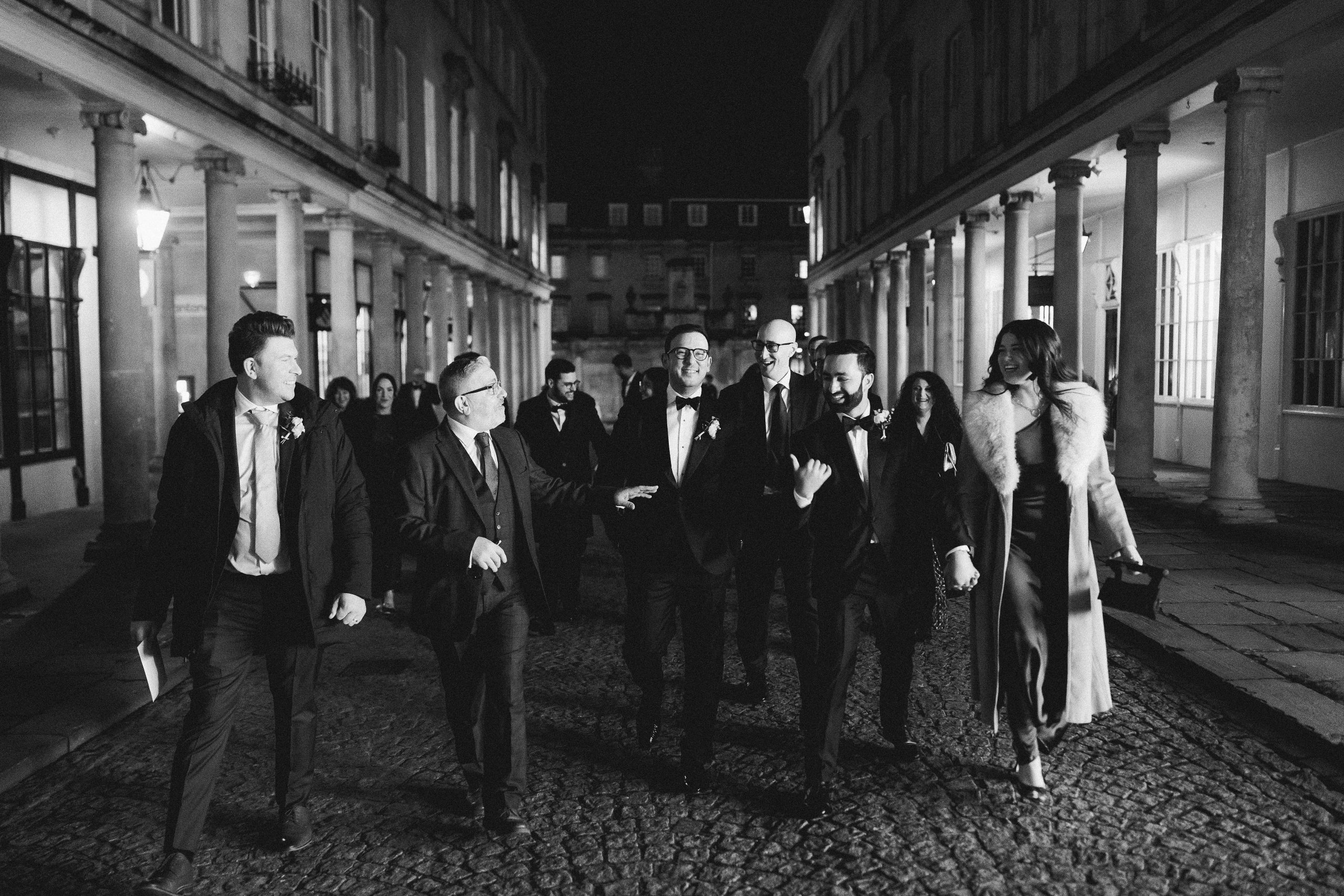 groom and friends walking through Bath