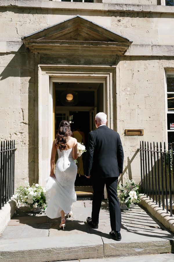 bride walking into the house of St Johns