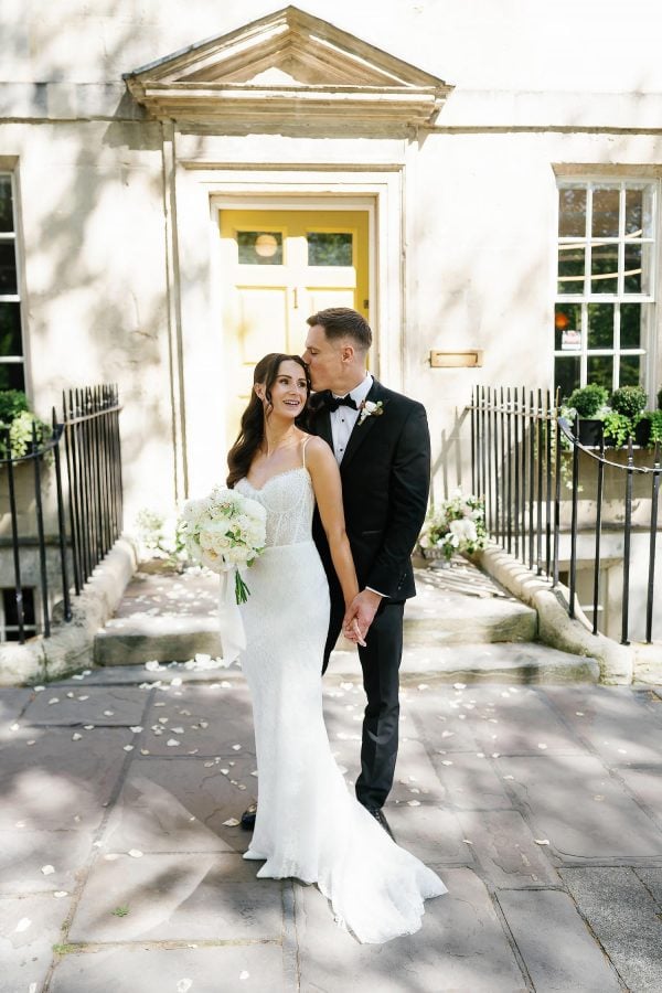 bride and groom outside the house of St Johns
