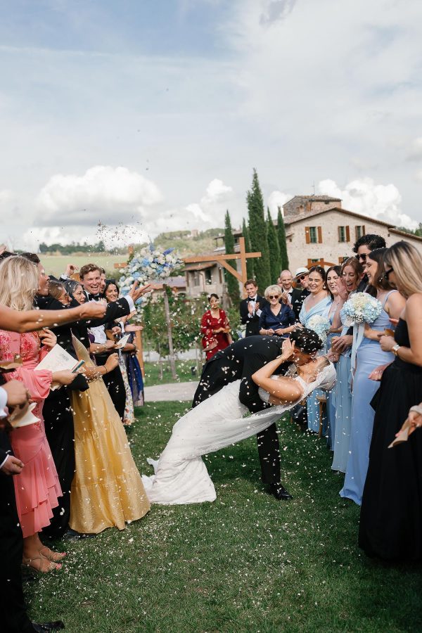 couple kissing after wedding ceremony